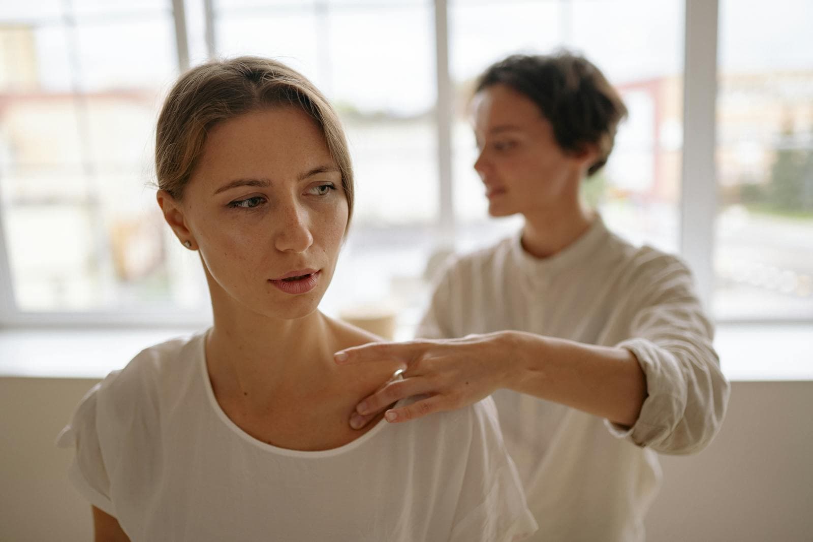 Therapist providing back neck and shoulder massage